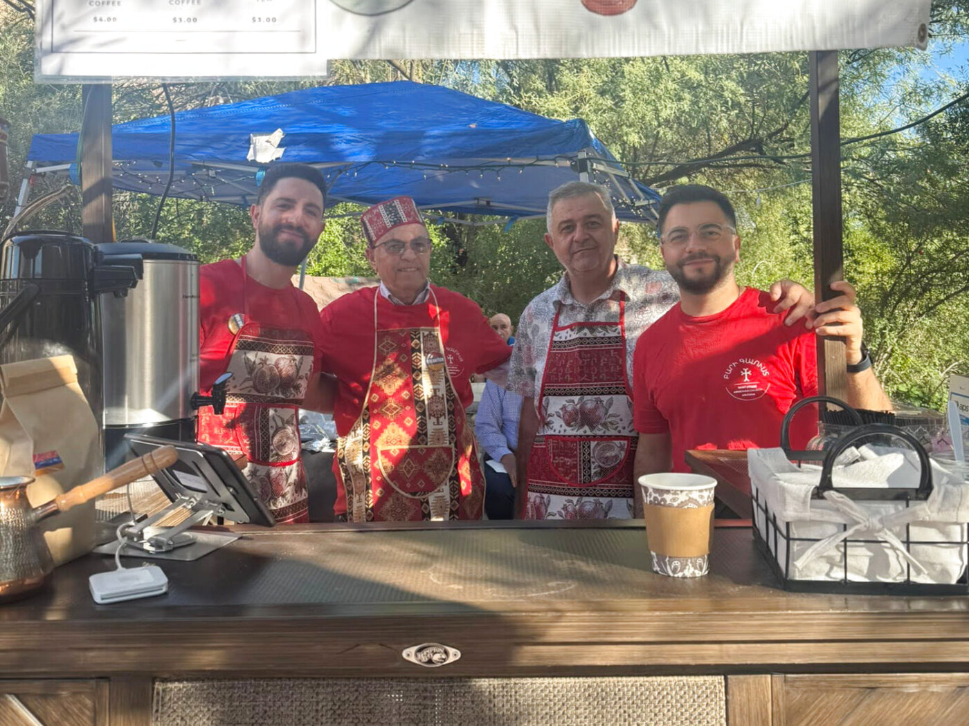 Volunteers behind the Armenian coffee and tea stand